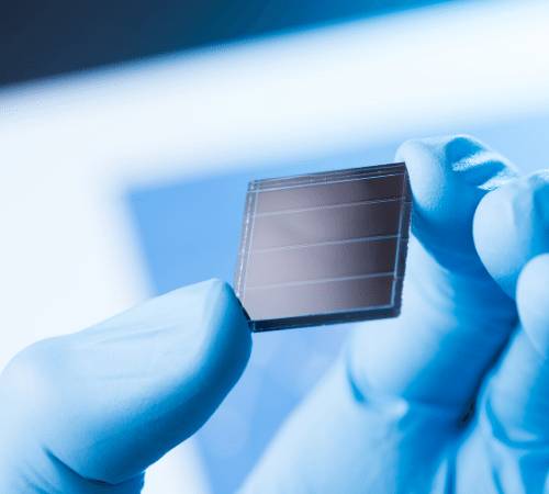 Hand holding solar panel cell 