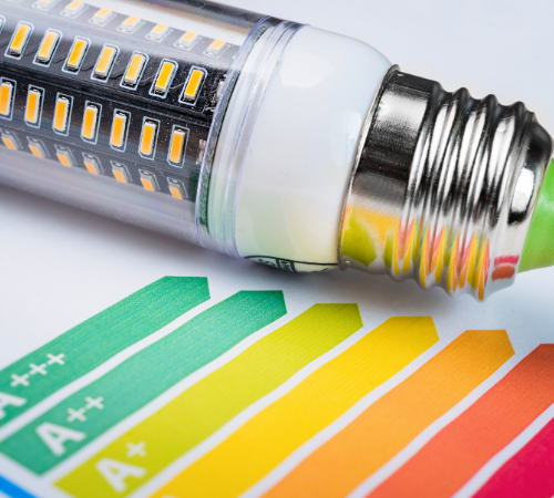 Energy audit efficiency scales sheet with bulb placed next to it