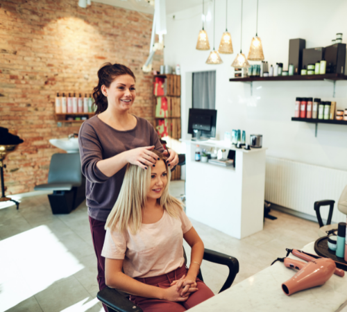 Hairdresser starting work with a client