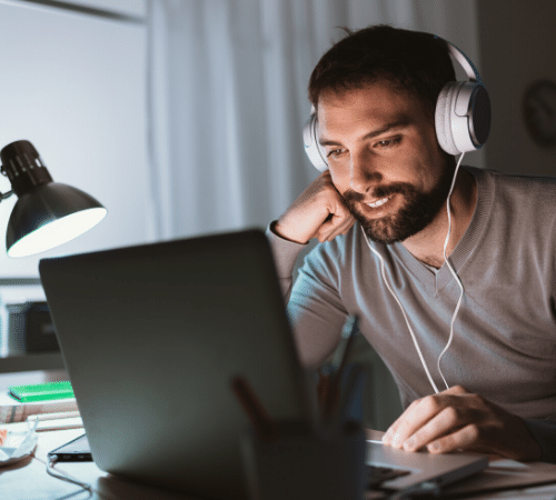 Man on his laptop listening to music