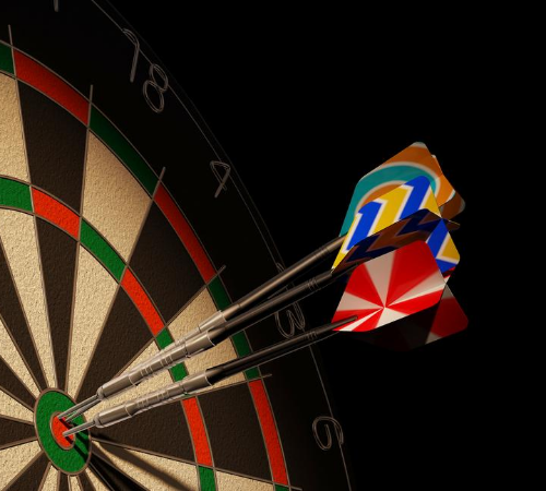 darts board with three darts on bullseye