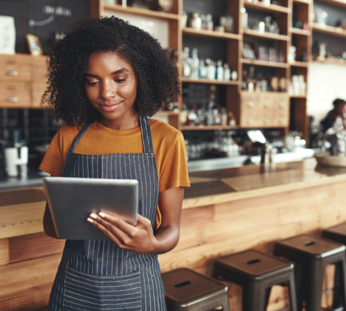 woman using tablet in cafe