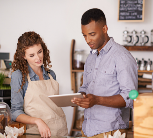two business owners using tablet for smart meter