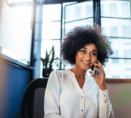 Lady on her phone in her home office
