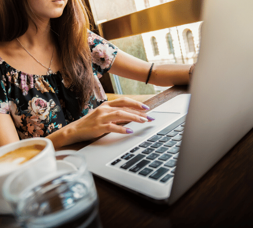 Lady working on her laptop in a café